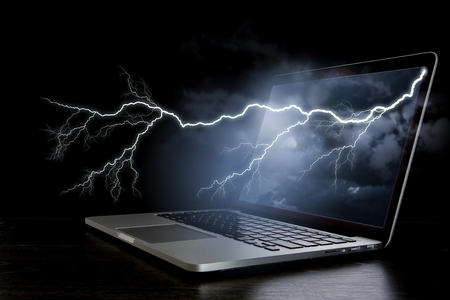 Laptop with lightning. Mixed media . Mixed mediaの写真素材