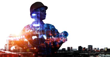 Engineer woman and cityscape. Mixed media . Mixed mediaの写真素材