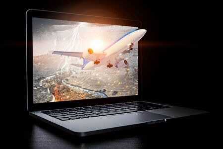 Airliner coming from laptop. Mixed mediaの写真素材