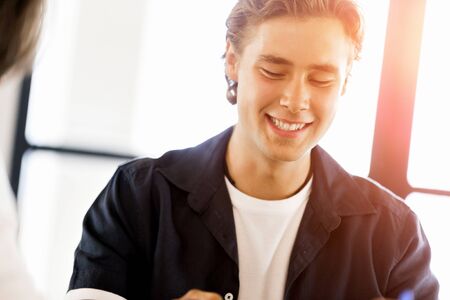 Young man in casual in officeの写真素材