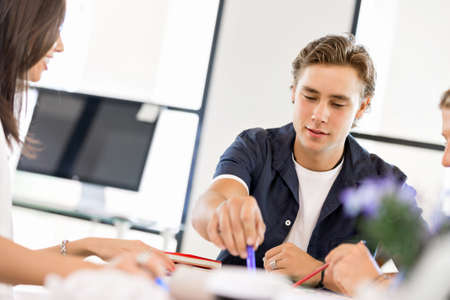 Young man in casual in officeの写真素材