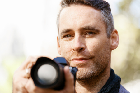 Male photographer taking picture