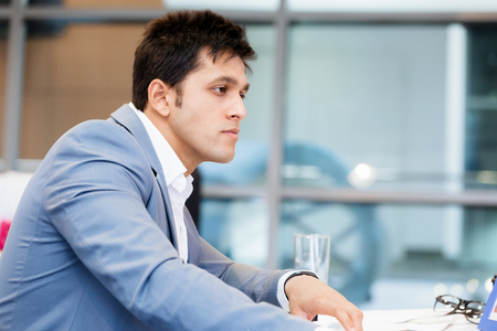 Another office day in front of computerの写真素材