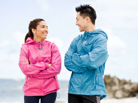 Young couple standing at beach