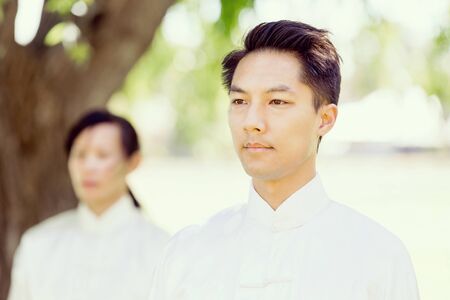Handsome man practicing thai chiの写真素材