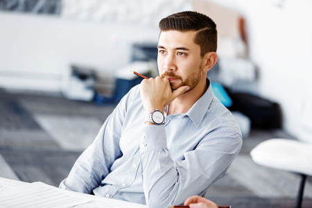 Handsome businessman in officeの写真素材