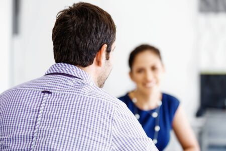 Attractive office worker sitting at desk