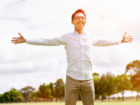Senior man fishing with his grandson to fish at seaの写真素材