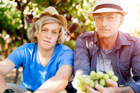 Father and son in vineyardの写真素材