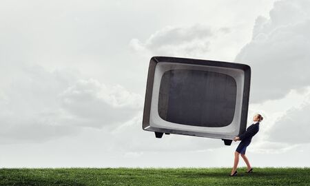 Woman and TV monitor . Mixed mediaの写真素材