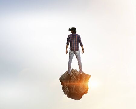 Man in virtual helmet . Mixed media