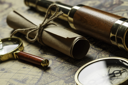 Concept of travel and discovery with old map and compass on itの写真素材