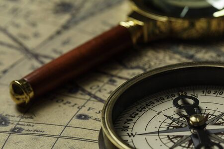 Retro compass with old map and magnifierの写真素材