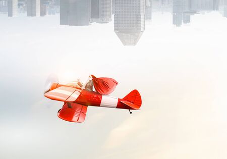 Santa hurrying up to deliver gifts. Mixed mediaの写真素材