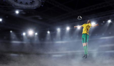 Soccer player at stadium. Mixed mediaの写真素材