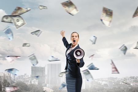 Woman making announcement. Mixed mediaの写真素材