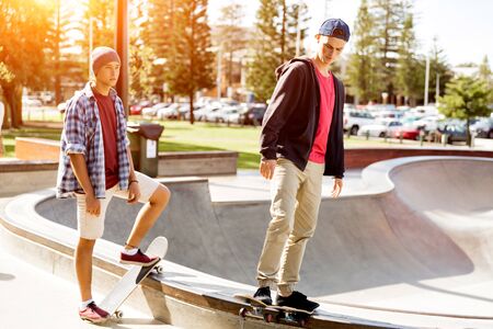 Teenage boy skateboarding outdoorsの写真素材