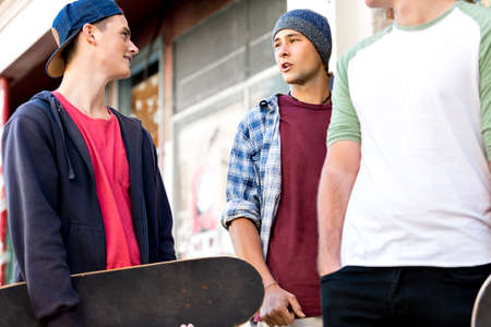 Teenagers walking down the street in summer dayの写真素材