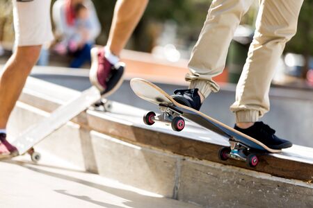 Teenage boy skateboarding outdoorsの写真素材