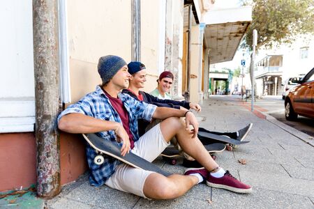 Skaters having a break at the streetの写真素材