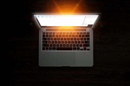 Glowing laptop device. Mixed mediaの写真素材