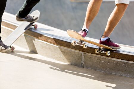 Teenage boy skateboarding outdoorsの写真素材