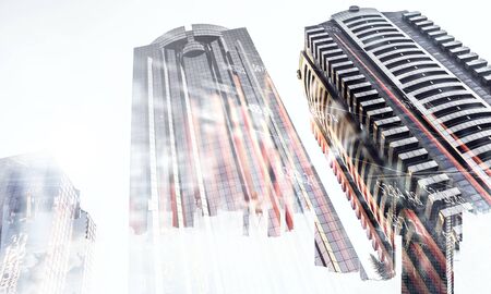 Double explosure with business charts and buildings
