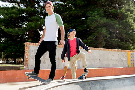 Teenage boy skateboarding outdoorsの写真素材