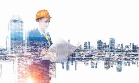 Attractive architect woman and her project. Mixed mediaの写真素材