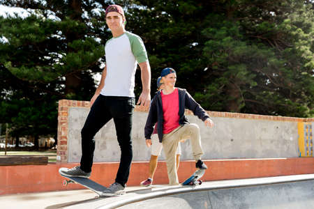 Teenage boy skateboarding outdoorsの写真素材