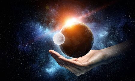 Earth planet in palm.の写真素材