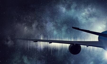 Turbine and wing of airplane flying in sky. Mixed media