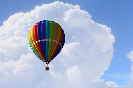 Colorful hot air balloon in blue sky. Mixed mediaの写真素材
