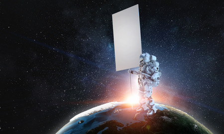 Spaceman with banner. Mixed mediaの写真素材
