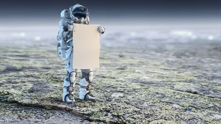 Astronaut in space holding white blank board. Mixed mediaの写真素材