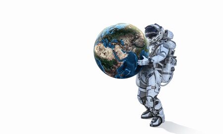 Astronaut carrying Earth planet in hands.の写真素材