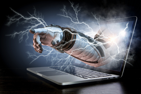 Hand of astronaut coming out of laptop screen. Mixed mediaの写真素材