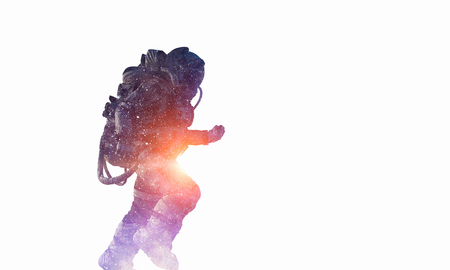 Double exposure of astronaut and space on white background. Mixed mediaの写真素材