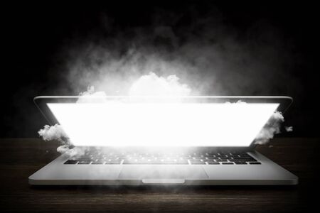 Glowing laptop device. Mixed mediaの写真素材