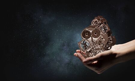 Metal gear mechanism in palm. Mixed media