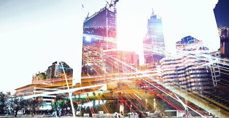 Double explosure with business charts and buildingsの写真素材
