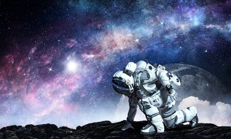 Spaceman wearing suit in start pose. Mixed media