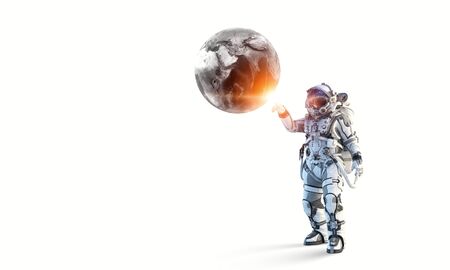 Astronaut touching with finger planet. Elements of this image furnished by NASAの写真素材