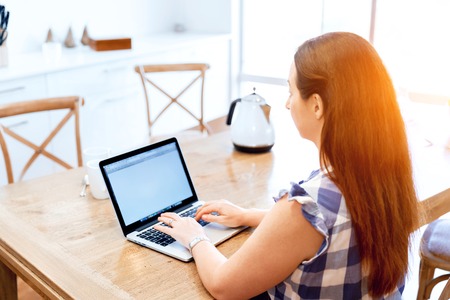 Mature beautiful woman working on her laptopの写真素材