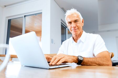 Man working on laptop at home