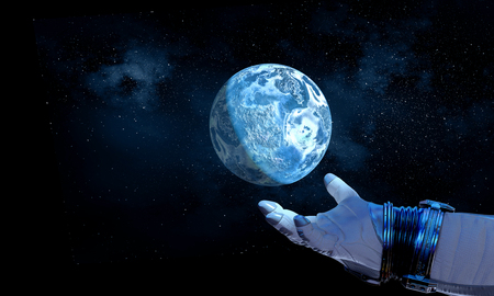 Astronaut hand and Earth in space.の写真素材