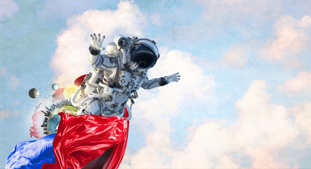 Astronaut touching with finger planet.の写真素材