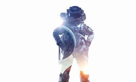 Double exposure of astronaut and space on white background. Mixed mediaの写真素材