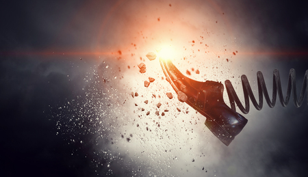 Concept of authority with businessman shoe on spring. Mixed mediaの写真素材