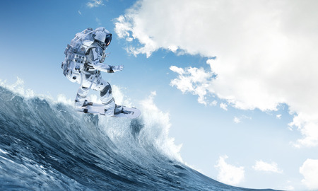 Spaceman on flying board surfing the sea. Mixed mediaの写真素材
